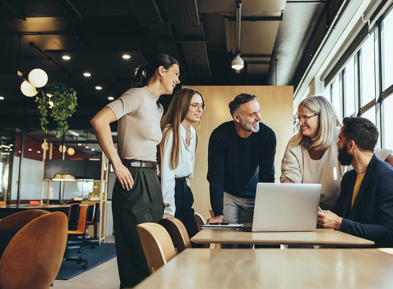 a group of employees at a business having a discussion